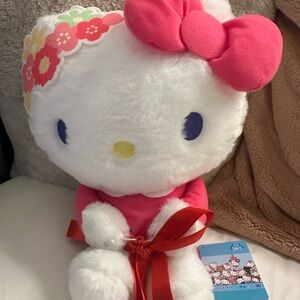 Taito Station Sanrio Hello Kitty Plush 
Dakko Pose Doll